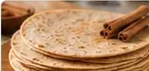 Tortilla me kanellë pranë kokrrave të kanellës